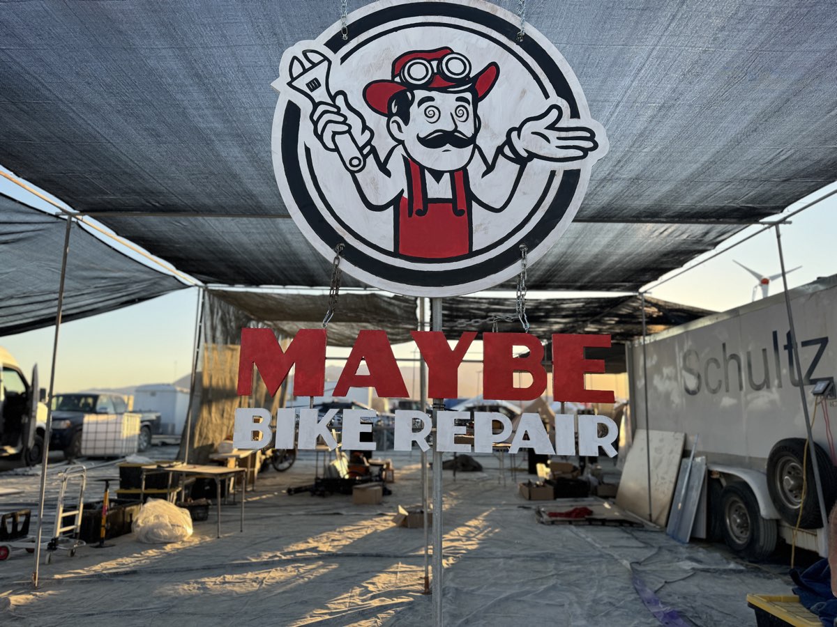 Maybe Bike Repair camp sign at Burning Man during setup